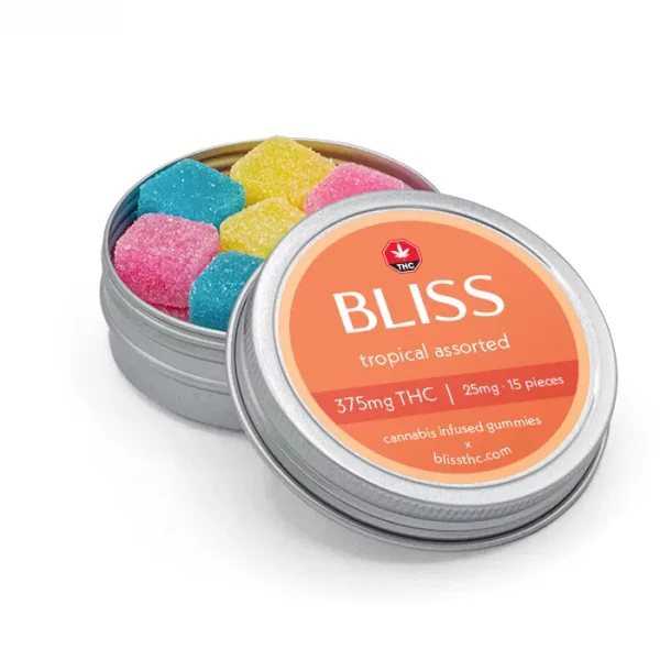 Open tin of Bliss Tropical Assorted THC gummies showing colorful sugar-coated cubes in yellow, pink, and blue.